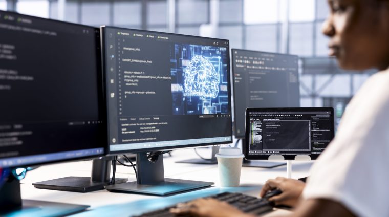 Admin in server farm using artificial intelligence technology for increased productivity in startup company. Machine learning expert in data center implementing AI driven solutions